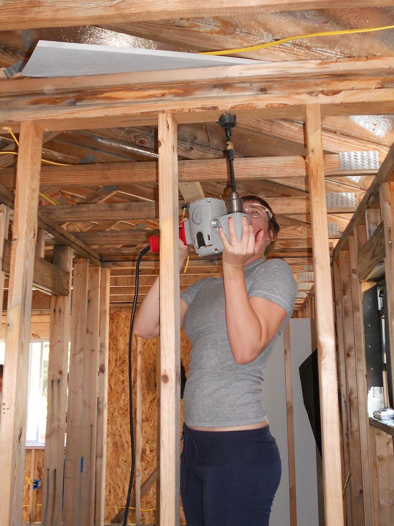 Drilling top plate opening for electrical wires Building Construction