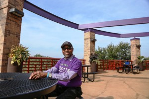 The Riverside Campus balcony eventually will have an awning for heat control and an extra touch of purple. Campus Manager Frank Taylor has helped with the mini-makeover.