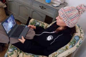 Nicolette Davis watches an online worship service on Nov. 26, 2020 from the comfort of her home in Austin, TX.