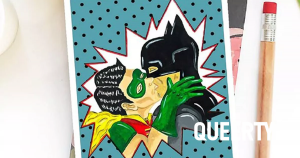 Batman & Robin illustrated on a Valentine's Day card in a kissing embrace.