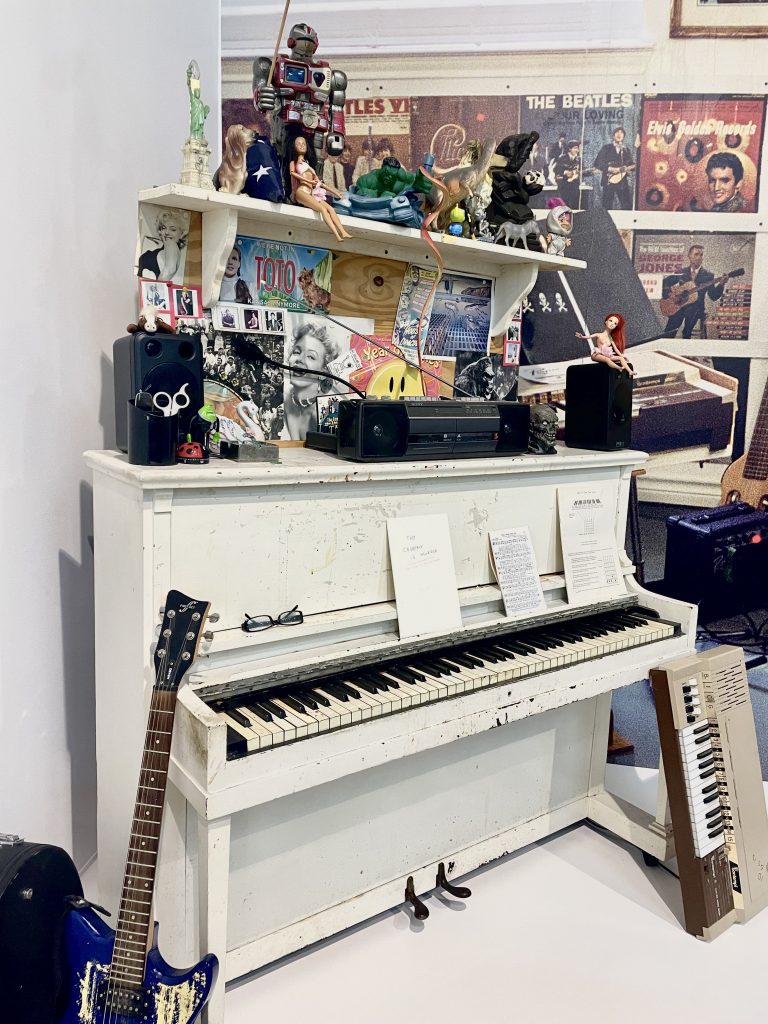 Daniel Johnston's musical instruments are arranged in a display in The Contemporary Austin's Jones Center.