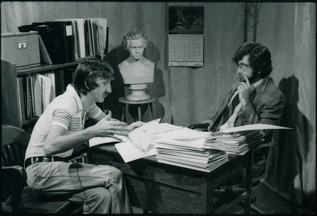 George Wilkerson teaching in office on phone