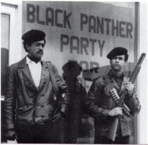 Huey Newton and Bobby Seale Standing on Oakland Street, Armed with Shotguns