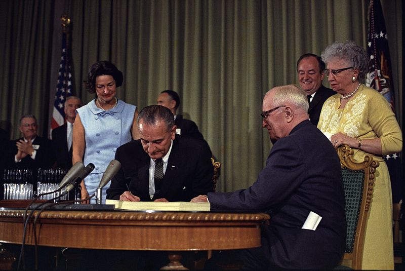 Lyndon Johnson Signing Medicare Bill with Harry Truman, July 30, 1965