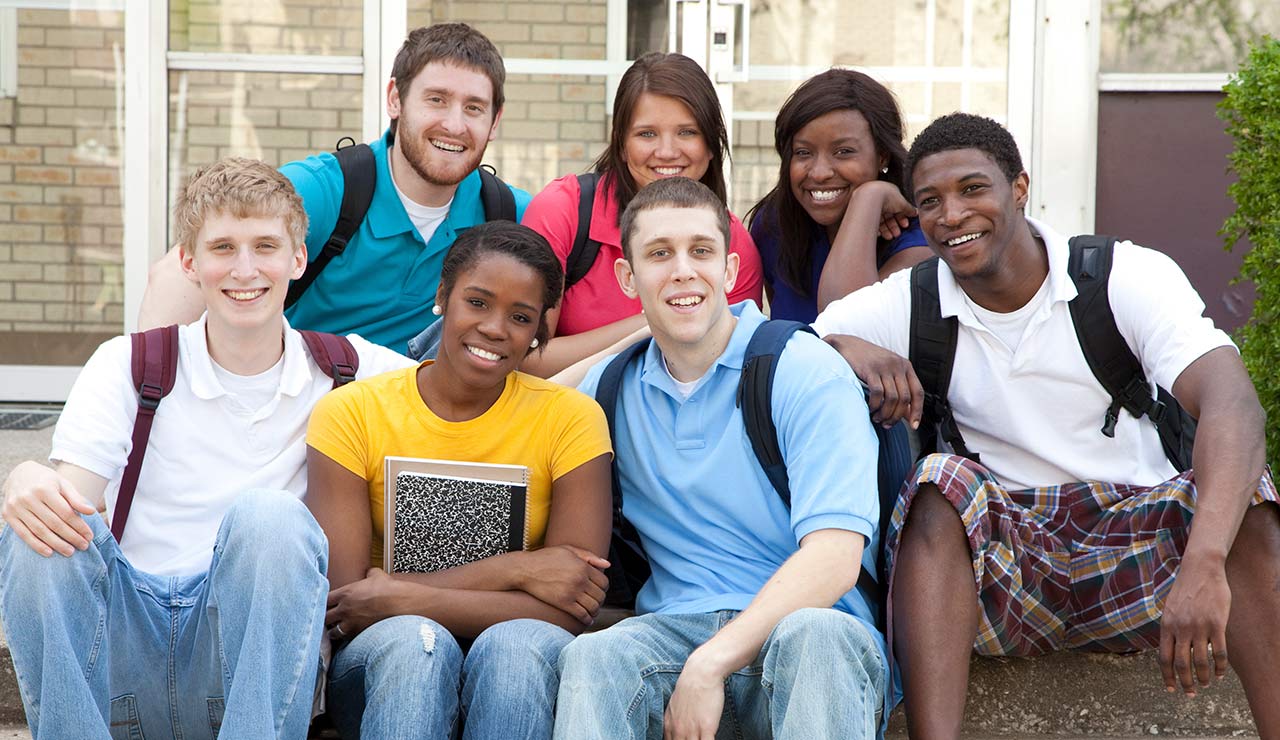 image of college students sitting on steps
