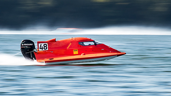 Race boat speeding on water