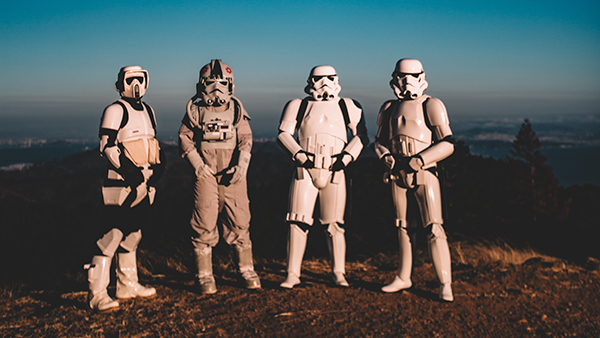 Four people dressed as Star Wars Stormtroopers