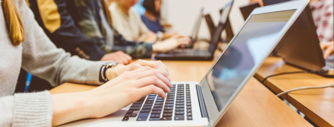 person typing on keyboard