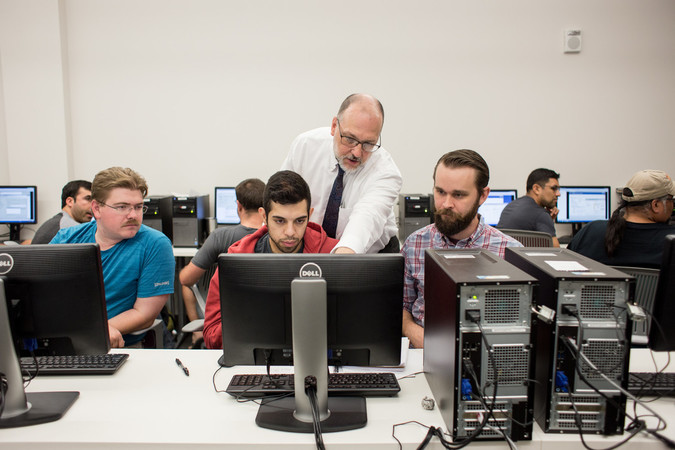 Students and professor in a computer lab