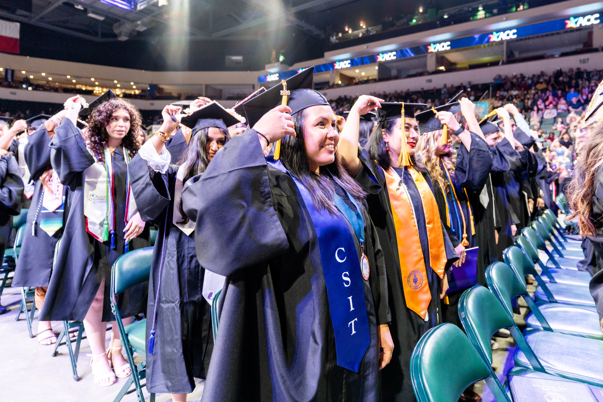 BAS Software Development graduate in graduation regalia and CSIT stole at Commencement Ceremony