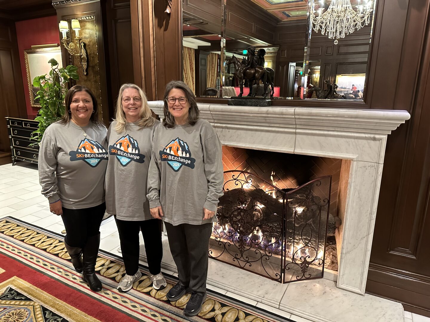 photograph of Linda Smarzik, Karina Hernandez, and Pan Fant-Saez at CBExchange
