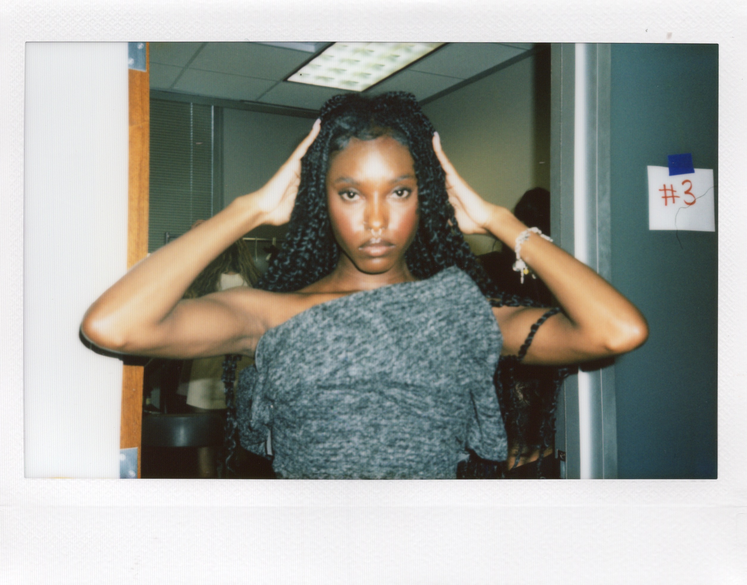 Woman poses in front of the camera before Fashion Show