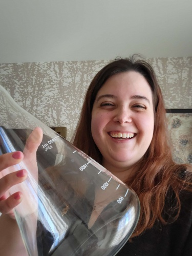 Amber Traylor holding glass beaker