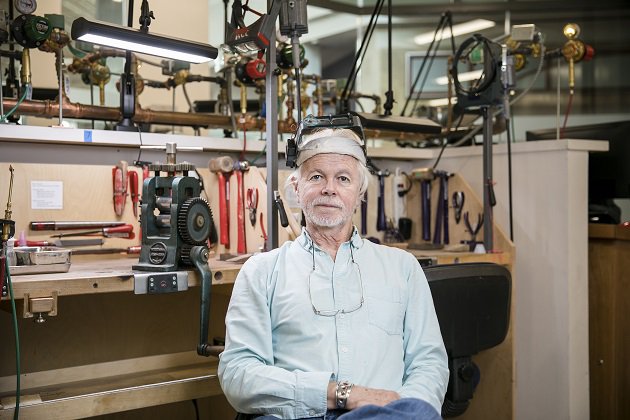 James Lynn sitting in jewelry making toolshop