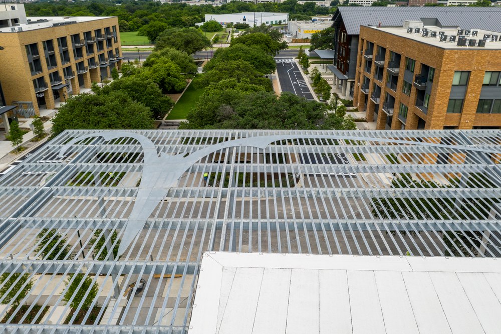 Top-down view of Riverbat logo on paseo canopy at ACC Highland