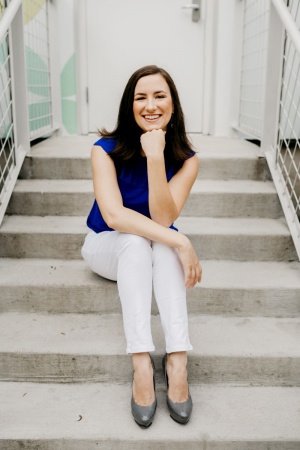 Jenny Elder-Moke sitting on steps outside door