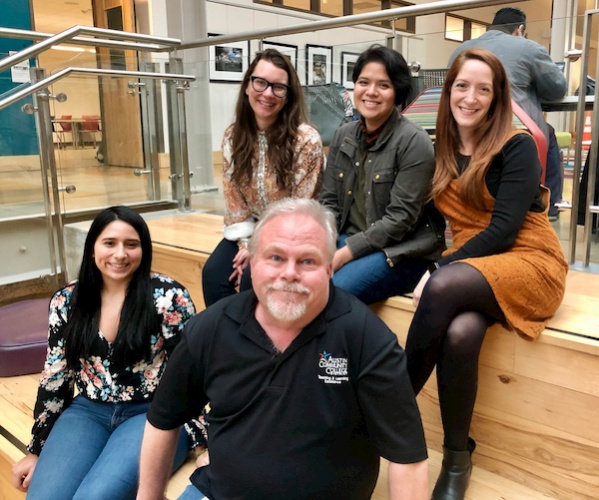 Five faculty and staff members on ACC Highland social staircase during Spring Development Day

