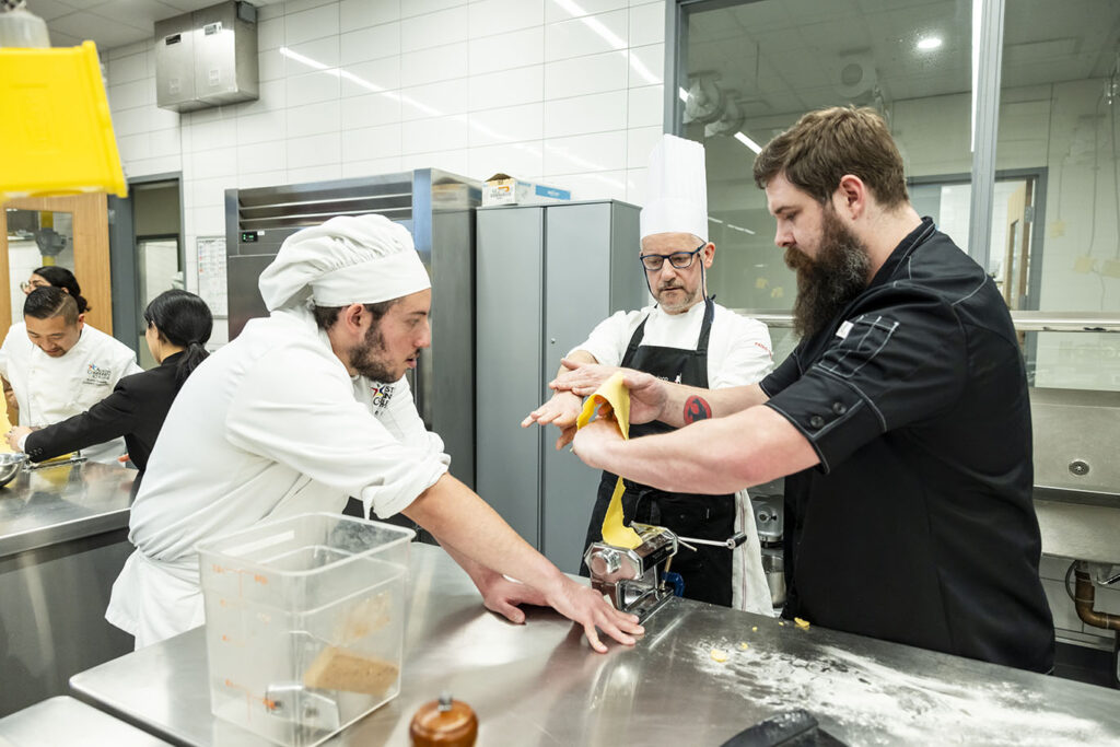 Italian Chef Paolo Taricco leads a hands-on pasta-making demonstration for Austin Community College Culinary Arts students, alumni, and industry partners on Wednesday, Jan. 28, 2025, in the Demonstration Kitchen at Highland Campus.