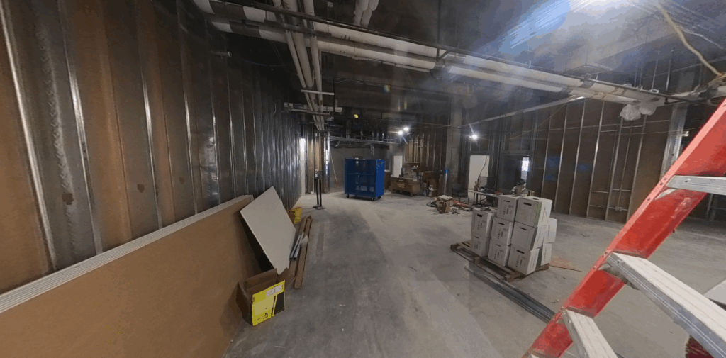 Room under construction with dry wall and exposed beams
